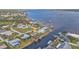 Aerial view of waterfront homes with private docks along the canal at 5194 Fleming St, Port Charlotte, FL 33981