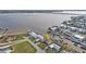 Aerial view of home and canal-front neighborhood with easy access to the bay at 5194 Fleming St, Port Charlotte, FL 33981