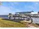 Waterfront property with a covered boat lift provides easy access to the open water at 5194 Fleming St, Port Charlotte, FL 33981