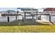 View of the waterfront dock, boat lift, and neighborhood at 5194 Fleming St, Port Charlotte, FL 33981