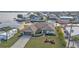 Aerial view of property with well-kept lawn, landscaping, and driveway at 5194 Fleming St, Port Charlotte, FL 33981