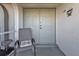 Cozy front porch featuring a chair and view of the double doors at 5194 Fleming St, Port Charlotte, FL 33981