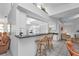 Kitchen area featuring bar counter with stools, white cabinetry, and an open design that flows into the living spaces at 5194 Fleming St, Port Charlotte, FL 33981