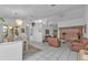 Bright open living room featuring white tile flooring, light colored walls, and leather furniture at 5194 Fleming St, Port Charlotte, FL 33981