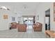 Bright living room featuring white tile flooring, light colored walls, and leather furniture at 5194 Fleming St, Port Charlotte, FL 33981