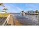 Waterfront view showcasing the canal and nearby properties on a sunny day at 5194 Fleming St, Port Charlotte, FL 33981