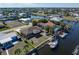 Aerial view of house, backyard, and boat slip on canal at 520 Boardman Dr, Punta Gorda, FL 33950