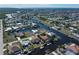 Bird's eye view showcasing home's location on canal with neighboring houses at 520 Boardman Dr, Punta Gorda, FL 33950