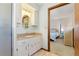 Bathroom with granite vanity, and a view into bedroom at 520 Boardman Dr, Punta Gorda, FL 33950