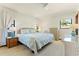 Main bedroom with king-size bed and wicker furniture at 520 Boardman Dr, Punta Gorda, FL 33950