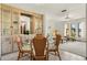 Dining area with built-in hutch and wicker dining table set at 520 Boardman Dr, Punta Gorda, FL 33950