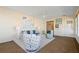 Bright living room with coastal decor and access to kitchen at 520 Boardman Dr, Punta Gorda, FL 33950