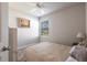 Well-lit bedroom featuring a double bed and window with blinds at 5277 Shell Mound Cir, Punta Gorda, FL 33982