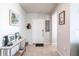 Bright and airy entryway with tile floors and coat rack at 5277 Shell Mound Cir, Punta Gorda, FL 33982