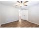 Bedroom with wood-look floors and double doors to closet at 5301 Sabal Palm Ln, Punta Gorda, FL 33982