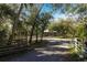 Long driveway leading to a house in a wooded area at 5301 Sabal Palm Ln, Punta Gorda, FL 33982