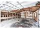 Interior of a detached garage with wooden shelves and a concrete floor at 5301 Sabal Palm Ln, Punta Gorda, FL 33982