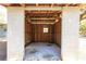 View of an empty small shed with concrete floor and wooden walls at 5301 Sabal Palm Ln, Punta Gorda, FL 33982