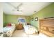 Light and airy bedroom with twin beds and dresser at 7233 N Plum Tree, Punta Gorda, FL 33955