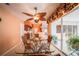 Bright dining area with glass table and chairs, adjacent to kitchen at 7233 N Plum Tree, Punta Gorda, FL 33955