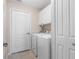 Laundry room with washer, dryer, and cabinets at 7543 S Blue Sage, Punta Gorda, FL 33955