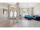 Bright and airy living room with tile floors and blue seating at 7543 S Blue Sage, Punta Gorda, FL 33955