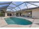 Relaxing screened-in pool area with patio furniture at 7543 S Blue Sage, Punta Gorda, FL 33955