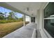 Covered patio with ceiling fans and a view of the backyard at 85 Snedeker St, Port Charlotte, FL 33954