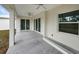 Covered patio with ceiling fans and sliding glass doors at 85 Snedeker St, Port Charlotte, FL 33954