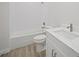 Clean bathroom with white tile, bathtub, toilet and modern vanity at 85 Snedeker St, Port Charlotte, FL 33954