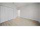 Bedroom with large closet and wood-look floors at 85 Snedeker St, Port Charlotte, FL 33954