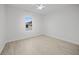 Bright bedroom featuring light wood flooring and a window at 85 Snedeker St, Port Charlotte, FL 33954