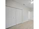 Spacious bedroom closet with white built-in shelving at 85 Snedeker St, Port Charlotte, FL 33954