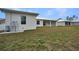 Back of house showing large backyard and utility area at 85 Snedeker St, Port Charlotte, FL 33954