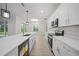 Modern kitchen with white cabinets, quartz countertops, and stainless steel appliances at 85 Snedeker St, Port Charlotte, FL 33954