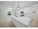 Modern kitchen with white cabinets and quartz countertops at 85 Snedeker St, Port Charlotte, FL 33954