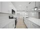 Modern kitchen with white cabinets and stainless steel appliances at 85 Snedeker St, Port Charlotte, FL 33954