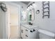 Modern bathroom with white vanity and marble countertop at 121 Cambridge Nw Dr, Port Charlotte, FL 33952