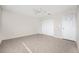 Simple bedroom with tile flooring and double door closet at 121 Cambridge Nw Dr, Port Charlotte, FL 33952