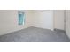 Simple bedroom with grey carpet and a double door closet at 121 Cambridge Nw Dr, Port Charlotte, FL 33952