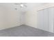 Simple bedroom with ceiling fan and large closet at 121 Cambridge Nw Dr, Port Charlotte, FL 33952