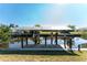 Private boat dock with covered lift and waterfront access at 121 Cambridge Nw Dr, Port Charlotte, FL 33952