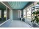 Enclosed porch with light teal door and tiled floor at 121 Cambridge Nw Dr, Port Charlotte, FL 33952