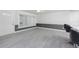 Open living space with gray and white color scheme and wood-look floors at 121 Cambridge Nw Dr, Port Charlotte, FL 33952