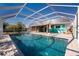 Inviting screened-in pool with patio area at 121 Cambridge Nw Dr, Port Charlotte, FL 33952