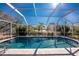 Large screened-in pool with patio at 121 Cambridge Nw Dr, Port Charlotte, FL 33952