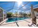 Enjoy this screened-in pool area at 121 Cambridge Nw Dr, Port Charlotte, FL 33952