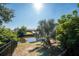 Peaceful waterfront view with lush landscaping at 121 Cambridge Nw Dr, Port Charlotte, FL 33952