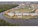 Aerial view of waterfront community with pool and boat slips at 1348 Rock Dove Ct # C204, Punta Gorda, FL 33950