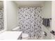 Clean bathroom with dog-themed shower curtain and modern vanity at 1348 Rock Dove Ct # C204, Punta Gorda, FL 33950